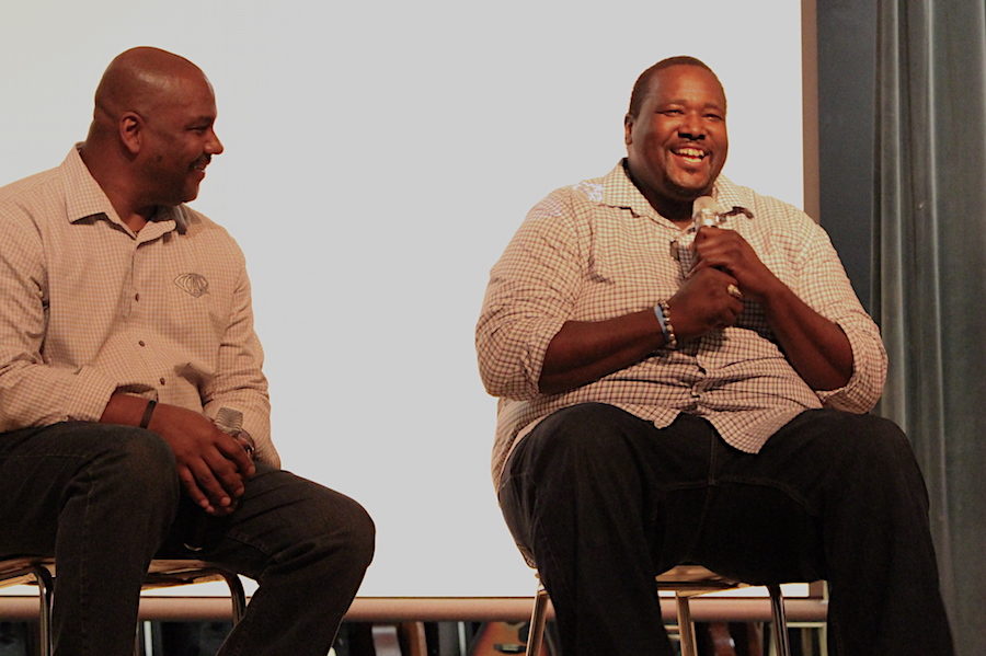 David Tyler (left), Aarons agent, and Quinton Aaron, speaking to Newsome High School students and parents on bullying in the auditorium.